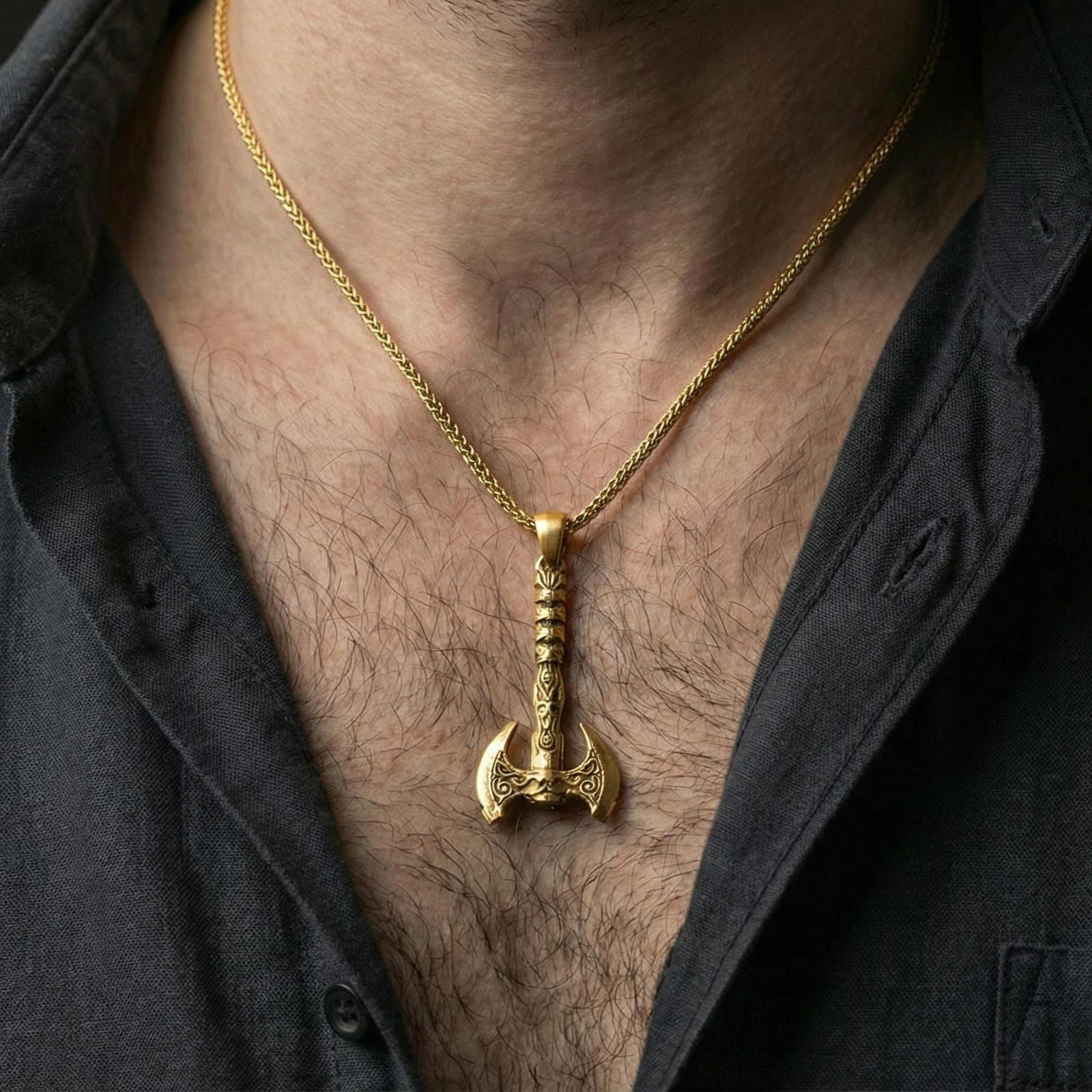 Gold plated Viking labrys axe necklace pendant worn on a human neck, double-headed axe charm, braided chain