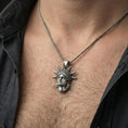 Load image into Gallery viewer, Oxidized sterling silver Statue of Liberty pendant worn on a human neck, NYC charm, braided chain necklace
