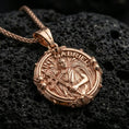 Load image into Gallery viewer, Rose gold plated Saint Gabriel coin pendant on matte volcanic stone, detailed angel engraving and decorative frame, sharp macro focus
