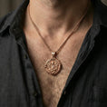 Load image into Gallery viewer, Rose gold plated Saint Gabriel coin pendant worn on neck, detailed archangel centerpiece, clean lifestyle framing with dark shirt contrast
