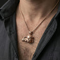 Load image into Gallery viewer, Rose gold plated Hypnos pendant worn on neck, detailed classical face centerpiece, clean lifestyle framing with dark shirt contrast
