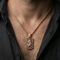 Load image into Gallery viewer, Rose gold plated zodiac tiger tag pendant worn on neck, detailed tiger relief, clean lifestyle framing with dark shirt contrast
