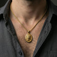 Load image into Gallery viewer, Gold plated roaring lion pendant necklace worn on neck, premium lifestyle composition, oval medallion with sculpted lion centerpiece
