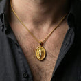 Load image into Gallery viewer, Gold plated Our Lady of Guadalupe pendant necklace worn on neck, premium lifestyle composition, devotional oval medallion centerpiece
