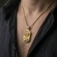 Load image into Gallery viewer, Gold plated Holy Family pendant necklace worn on neck, premium lifestyle composition, rectangular devotional medallion centerpiece
