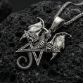 Load image into Gallery viewer, Oxidized sterling silver pentagram dragon pendant on textured volcanic rock, winged dragon wrapped around star frame, macro studio shot
