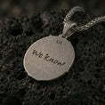 Load image into Gallery viewer, Oxidized sterling silver Skyrim Dark Brotherhood we know pendant on textured volcanic rock, iconic handprint emblem over skull pattern background, macro studio shot

