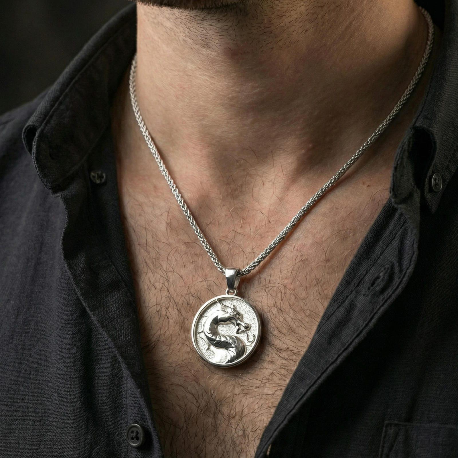 Polished silver Mortal Kombat dragon necklace worn on neck, clean lifestyle close-up highlighting dragon emblem and circular frame