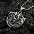 Load image into Gallery viewer, Oxidized sterling silver dragon pendant on volcanic rock, coiled mythical warrior amulet necklace closeup

