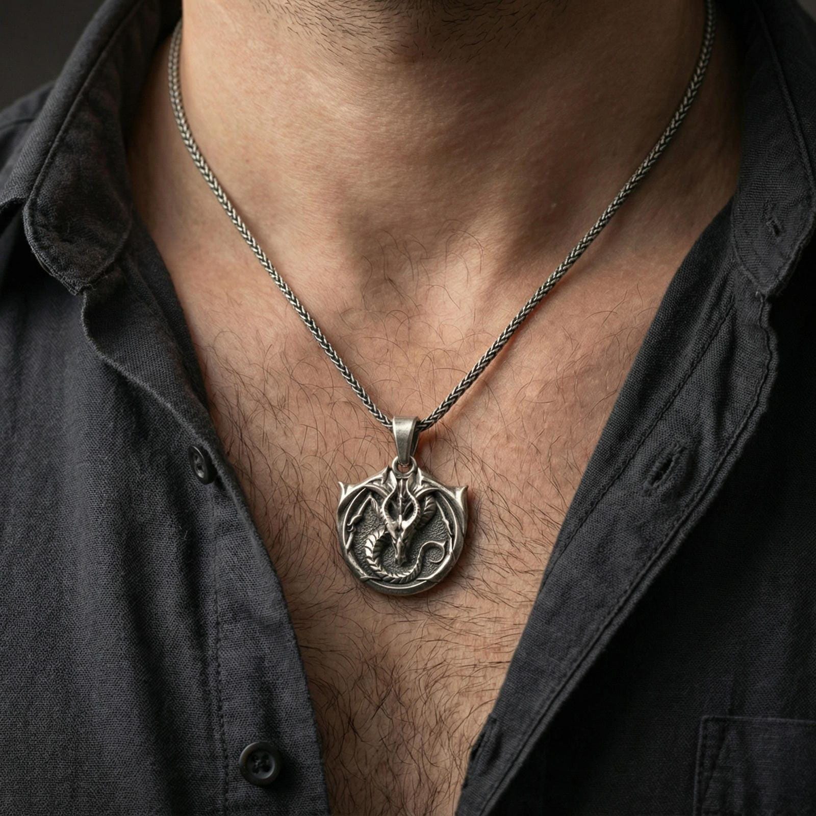 Oxidized dragon pendant worn on neck, bold gothic fantasy necklace with horned dragon emblem