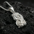 Load image into Gallery viewer, Polished silver Fortuna pendant necklace on porous volcanic stone, Roman goddess profile with cornucopia, macro close-up
