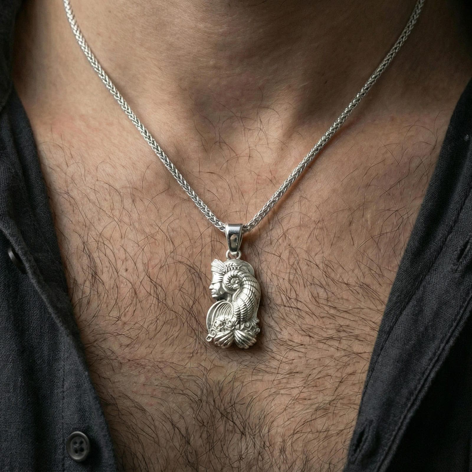 Polished silver Fortuna pendant worn on neck, Roman goddess profile necklace centered, clean lifestyle framing