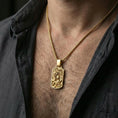 Load image into Gallery viewer, Gold plated dragon and phoenix pendant worn on neck, yin yang charm necklace gift, premium lifestyle framing
