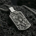 Load image into Gallery viewer, Oxidized sterling silver dragon and phoenix pendant on volcanic rock, yin yang harmony necklace, macro detail
