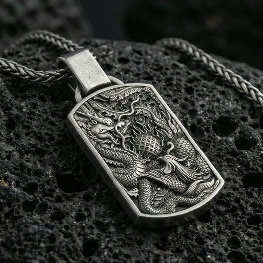 Oxidized sterling silver dragon and phoenix pendant on volcanic rock, yin yang harmony necklace, macro detail