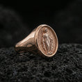 Load image into Gallery viewer, Rose gold plated Virgin Mary oval signet ring on volcanic stone, Marian devotional jewelry, premium macro lighting

