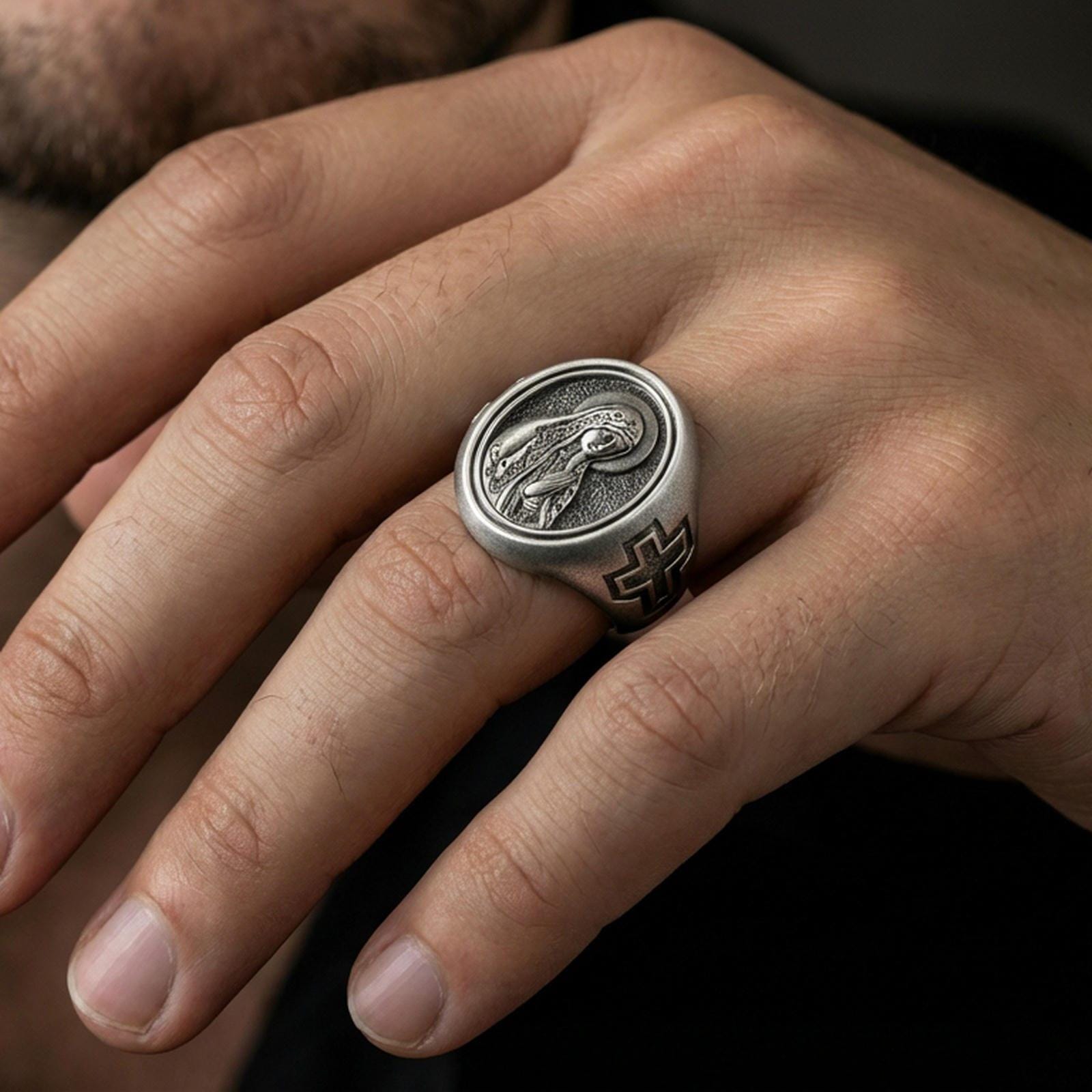 Oxidized sterling silver Our Lady of Guadalupe signet ring worn on finger, Catholic Marian seal ring, lifestyle close-up