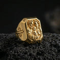Load image into Gallery viewer, Gold plated Holy Family ring on dark volcanic rock, Saint Joseph Mary Jesus signet ring, cross side motif close-up
