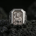 Load image into Gallery viewer, Polished silver St John the Baptist ring on porous volcanic stone, Christian saint signet, detailed halo portrait
