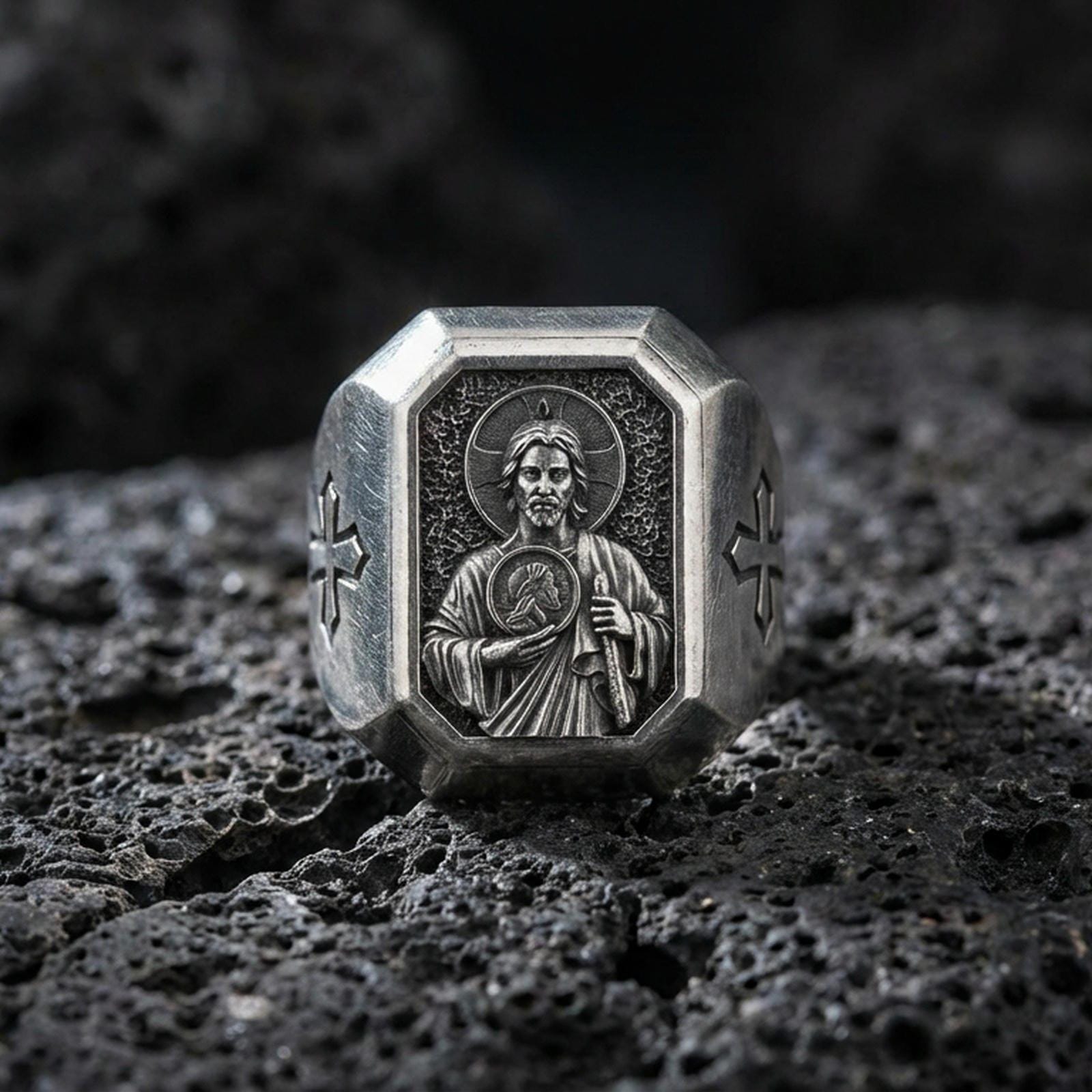 Oxidized sterling silver St Jude signet ring on volcanic rock, saint relief portrait, cross side engraving
