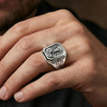 Load image into Gallery viewer, Polished silver Saint Benedict signet ring worn on finger, Christian protection ring, detailed halo engraving
