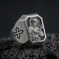 Load image into Gallery viewer, Oxidized sterling silver Saint Francis signet ring on volcanic rock, engraved saint icon, cross shoulder detail
