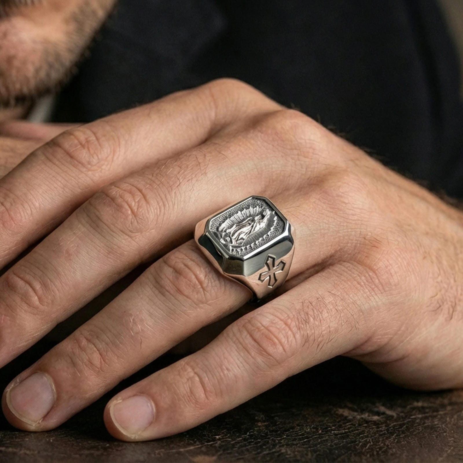 Polished silver Our Lady of Guadalupe signet ring worn on finger, Catholic faith ring, detailed Virgin Mary engraving