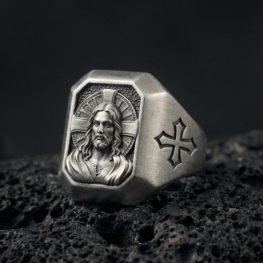 Oxidized sterling silver Jesus Christ signet ring on volcanic rock, sacred portrait relief, cross shoulder engraving