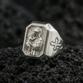 Load image into Gallery viewer, Polished silver St Anthony ring on porous volcanic stone, detailed saint portrait carving, Christian signet jewelry

