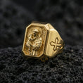 Load image into Gallery viewer, Gold plated St Anthony signet ring on dark volcanic rock, saint and child relief, cross side accent
