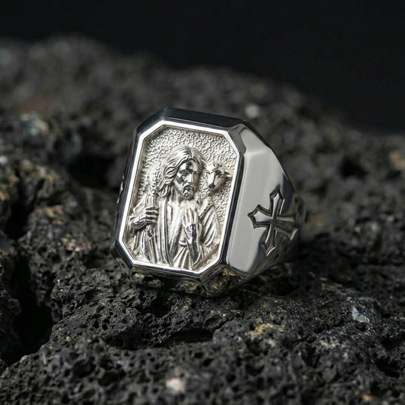 Polished silver Jesus Good Shepherd ring on porous volcanic stone, detailed shepherd portrait carving, Christian signet jewelry