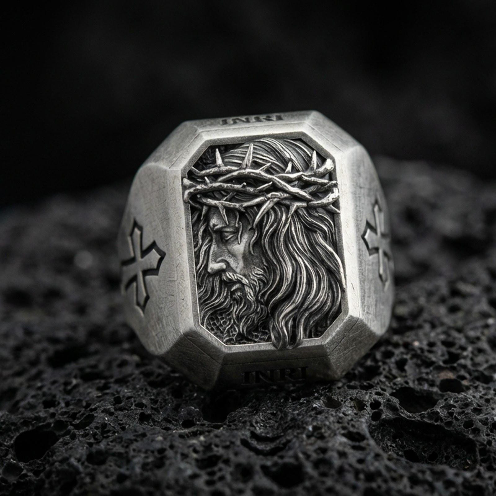Oxidized sterling silver Jesus Christ crown of thorns ring on volcanic rock, side-profile Christ relief, cross shoulder engravings