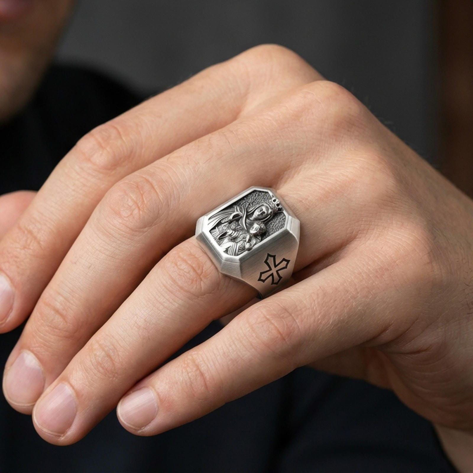 Oxidized sterling silver Virgin Mary signet ring worn on finger, crowned Madonna and Child relief, Catholic faith jewelry
