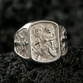 Load image into Gallery viewer, Polished silver Saint Christopher signet ring on porous volcanic stone, traveler protector icon relief, detailed engraving close-up
