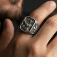 Load image into Gallery viewer, Oxidized sterling silver Saint Michael ring worn on finger, archangel defeating Satan relief, protector Christian jewelry
