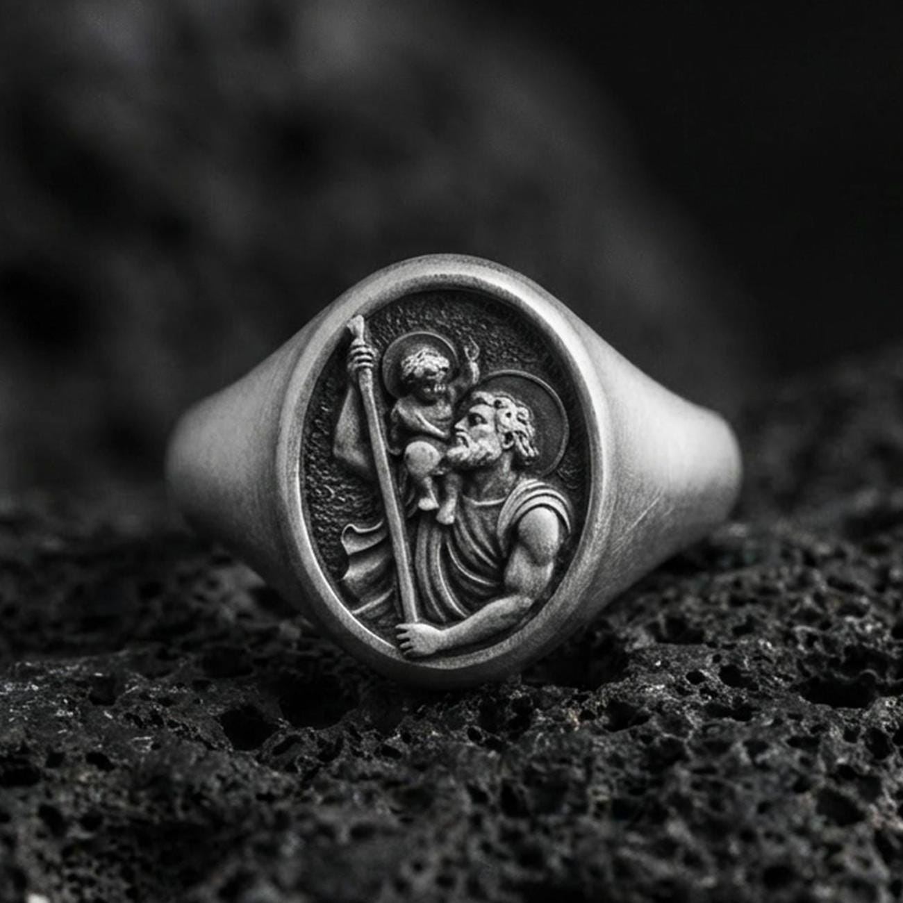 Oxidized sterling silver St Christopher signet ring on volcanic rock, patron saint traveler relief, Catholic protection ring