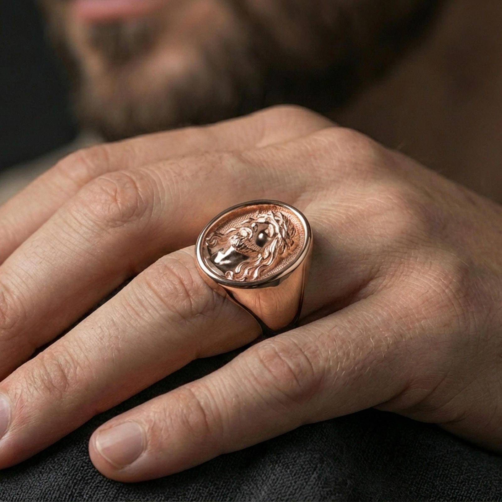 Rose gold plated Jesus portrait signet ring on hand, devotional faith jewelry with engraved Savior face