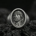 Load image into Gallery viewer, Oxidized 925 sterling silver Jesus signet ring on volcanic rock, crown of thorns Savior portrait closeup
