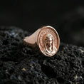 Load image into Gallery viewer, Rose gold plated Virgin Mary ring on volcanic stone, Madonna portrait relief, faith-inspired religious accessory
