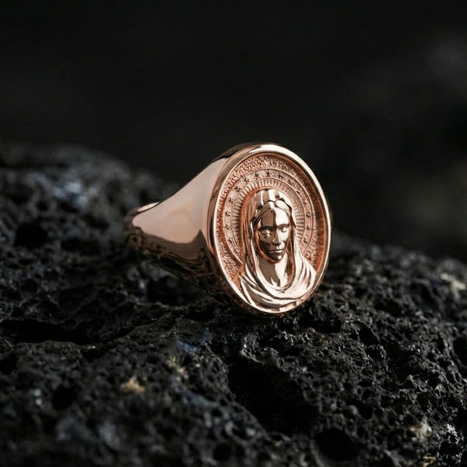 Rose gold plated Virgin Mary ring on volcanic stone, Madonna portrait relief, faith-inspired religious accessory