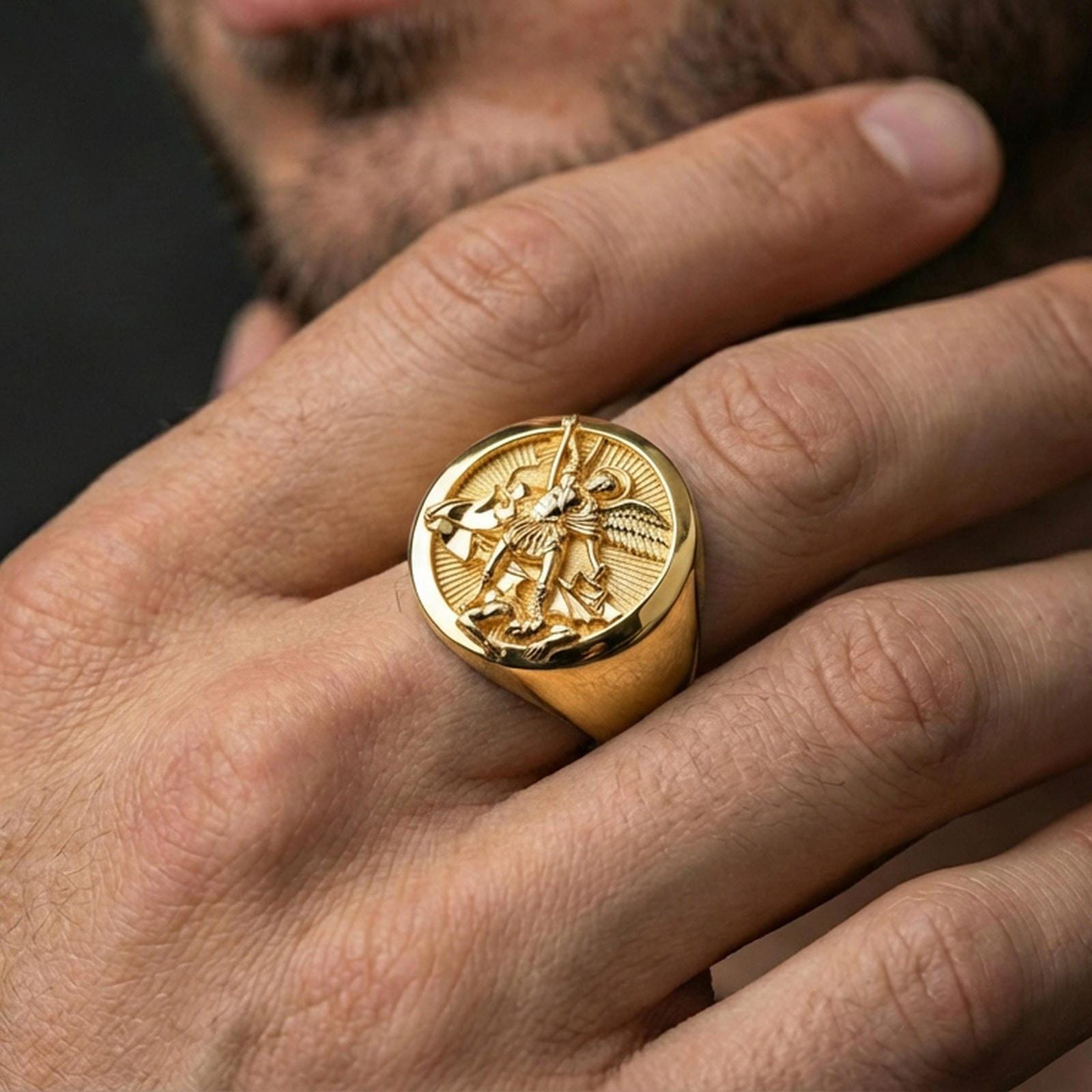 Gold plated St. Michael ring worn on finger, Catholic protection jewelry, archangel Michael victory symbol