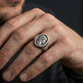 Load image into Gallery viewer, Oxidized Jesus signet ring worn on finger, Christian mens faith ring lifestyle view
