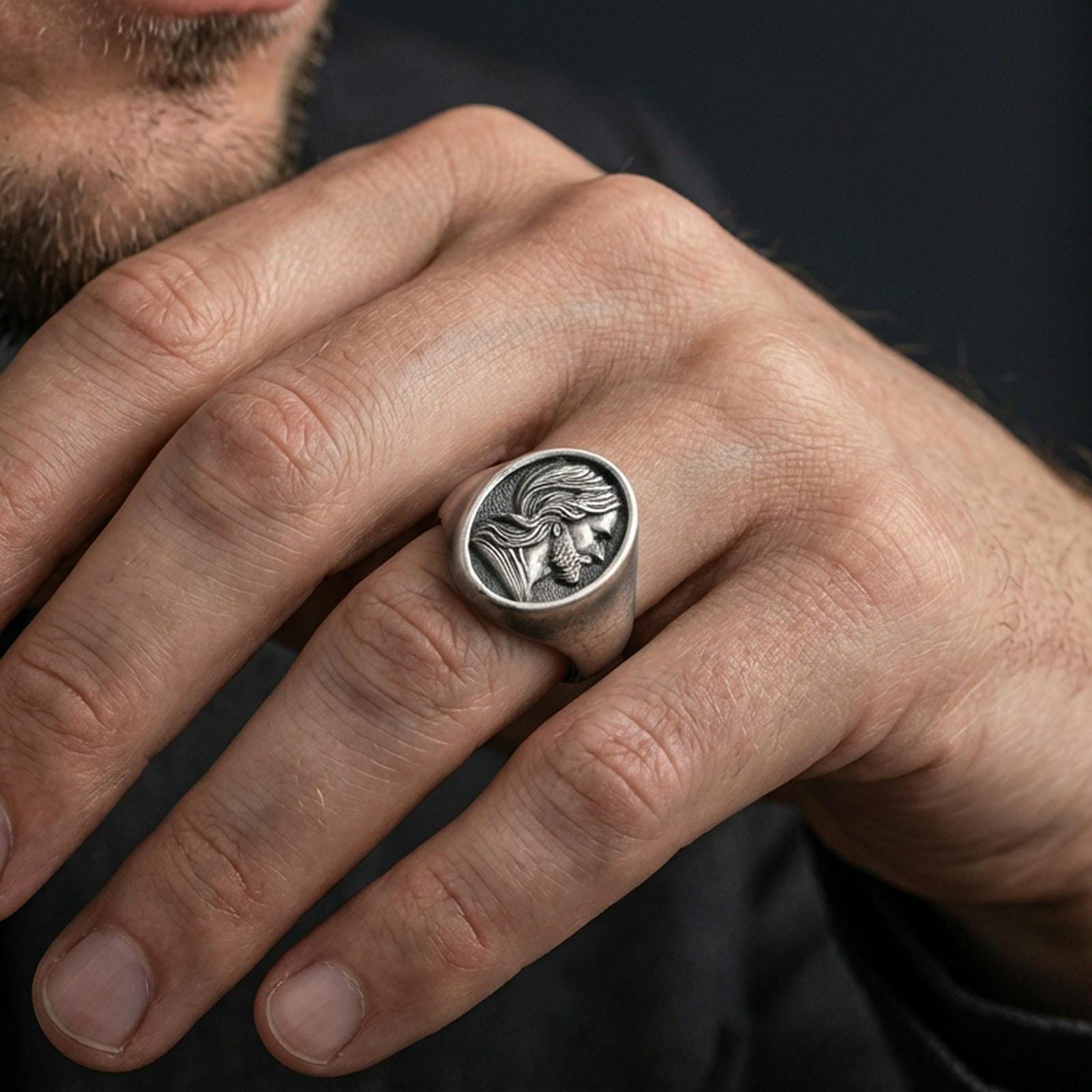 Oxidized Jesus signet ring worn on finger, Christian mens faith ring lifestyle view