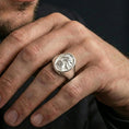 Load image into Gallery viewer, Polished silver Jesus portrait ring on hand, minimalist Christ icon ring close detail
