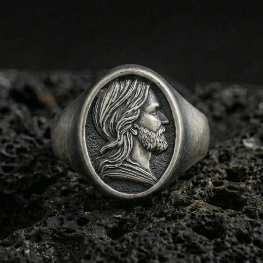 Oxidized sterling silver Jesus signet ring on volcanic rock, Christ portrait side profile relief