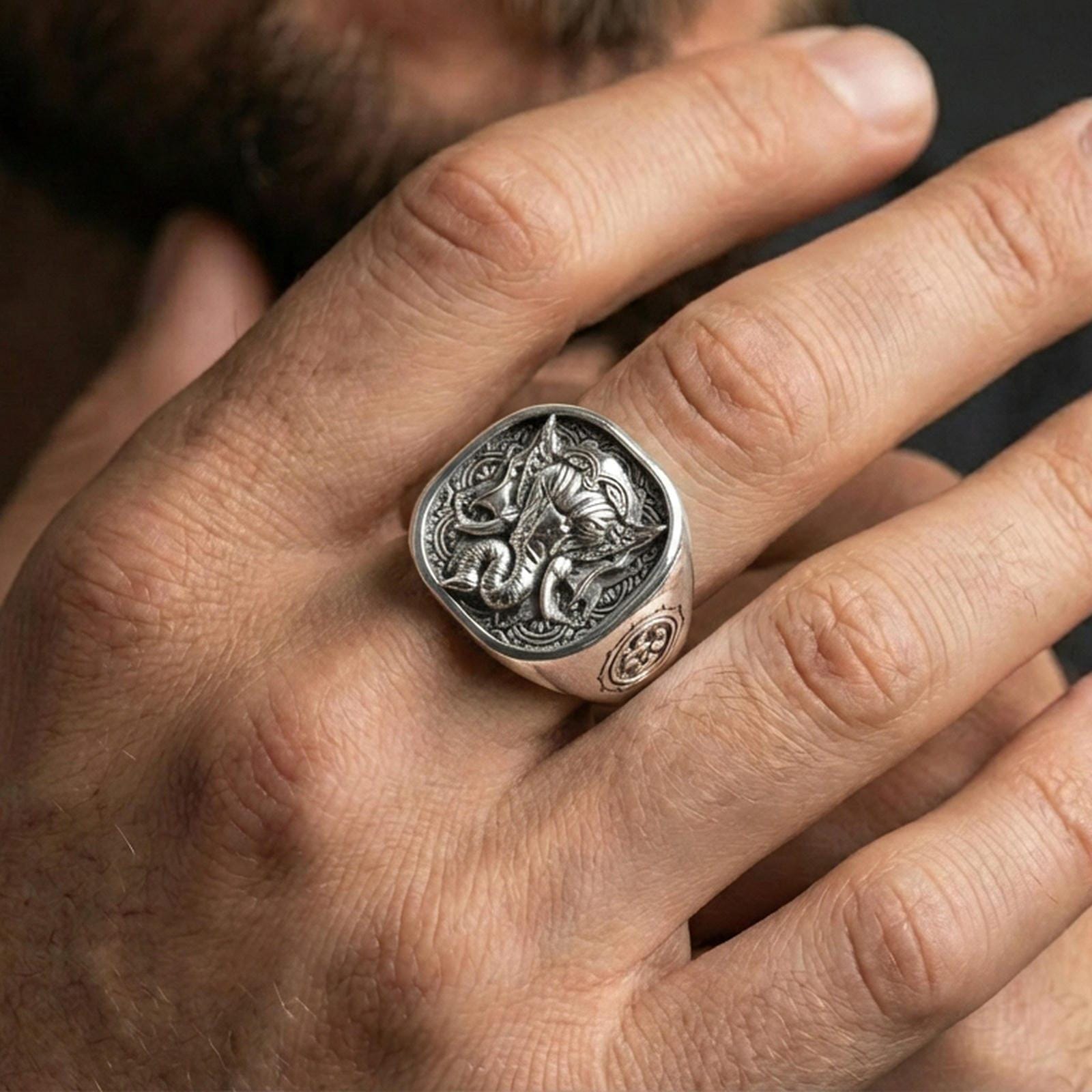 Polished silver Lord Ganesha ring worn on finger, Indian style engraving, spiritual statement signet