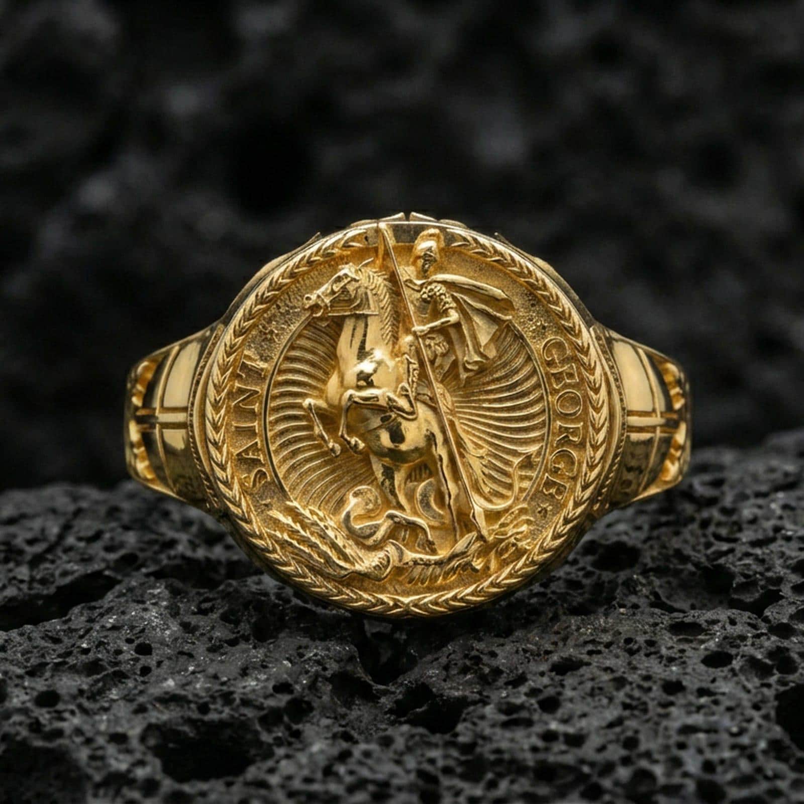 Gold plated St. George and dragon ring on dark volcanic rock, saint warrior medallion signet, gothic medieval jewelry