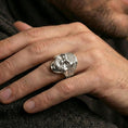 Load image into Gallery viewer, Polished silver skull mandala ring worn on finger, engraved floral mandala skull ring, bold everyday accessory
