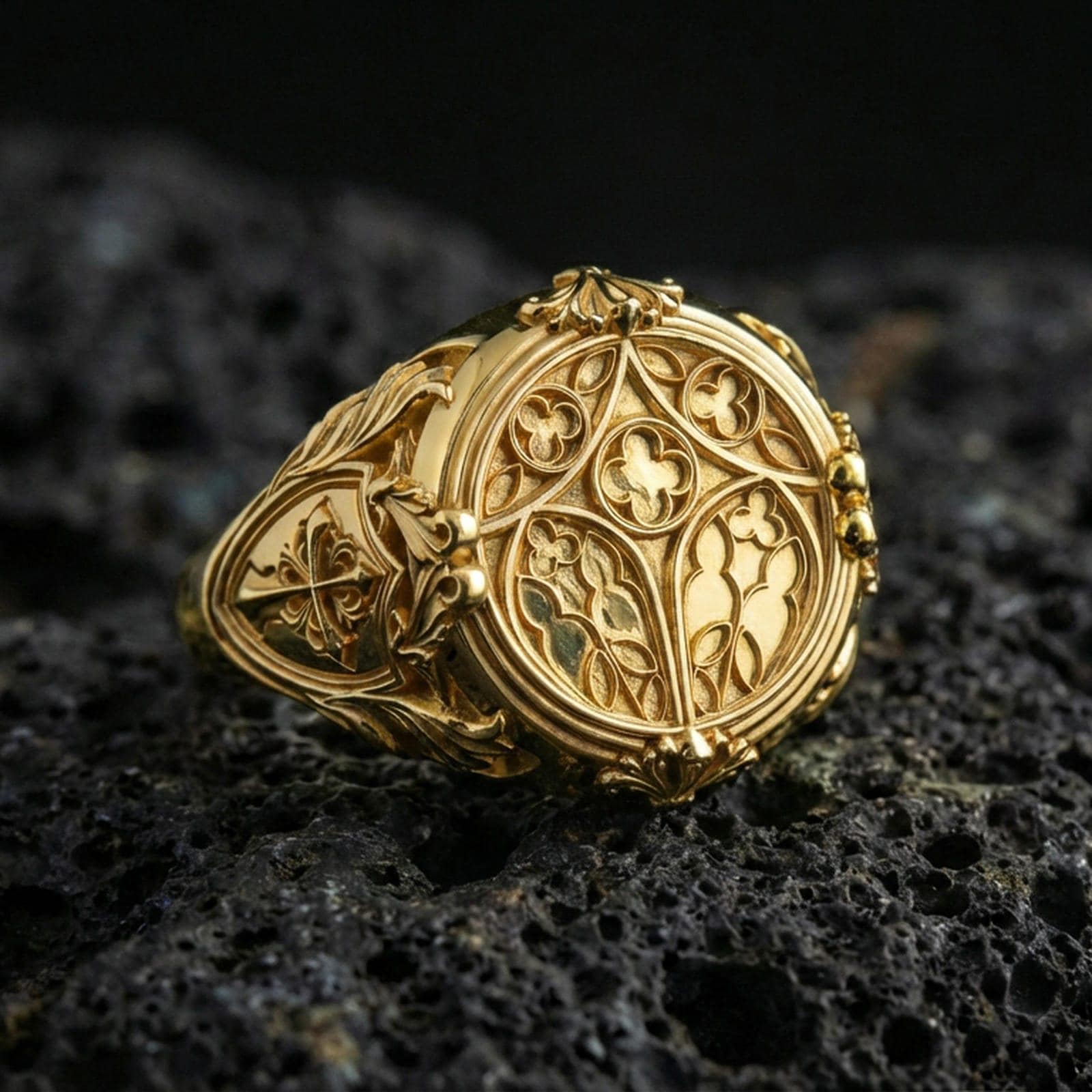 Gold plated sterling silver cathedral symbol ring on dark volcanic rock, stained glass motif, luxury statement jewelry