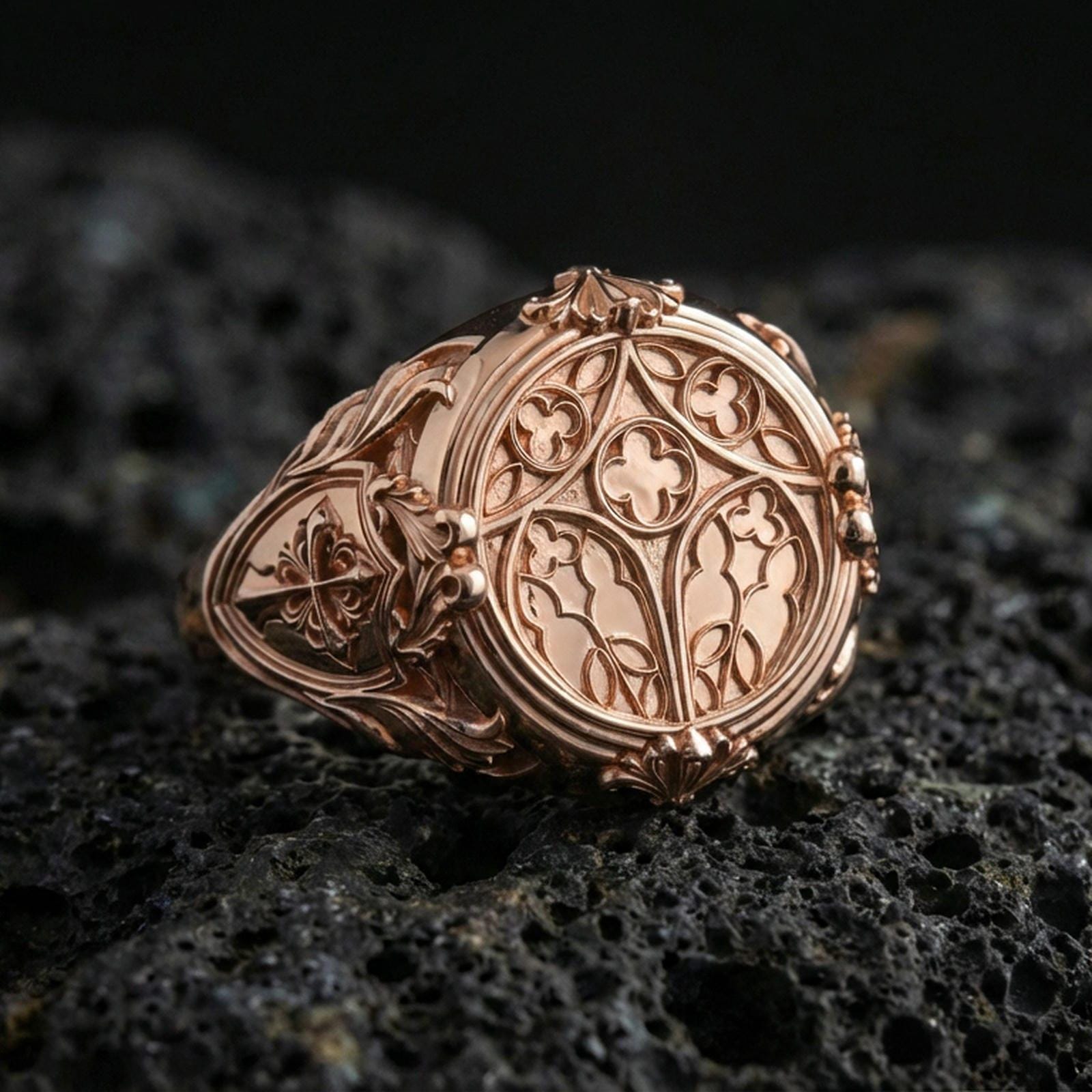Rose gold plated cathedral window signet ring on volcanic stone, ornate gothic arch design, vintage inspired ring